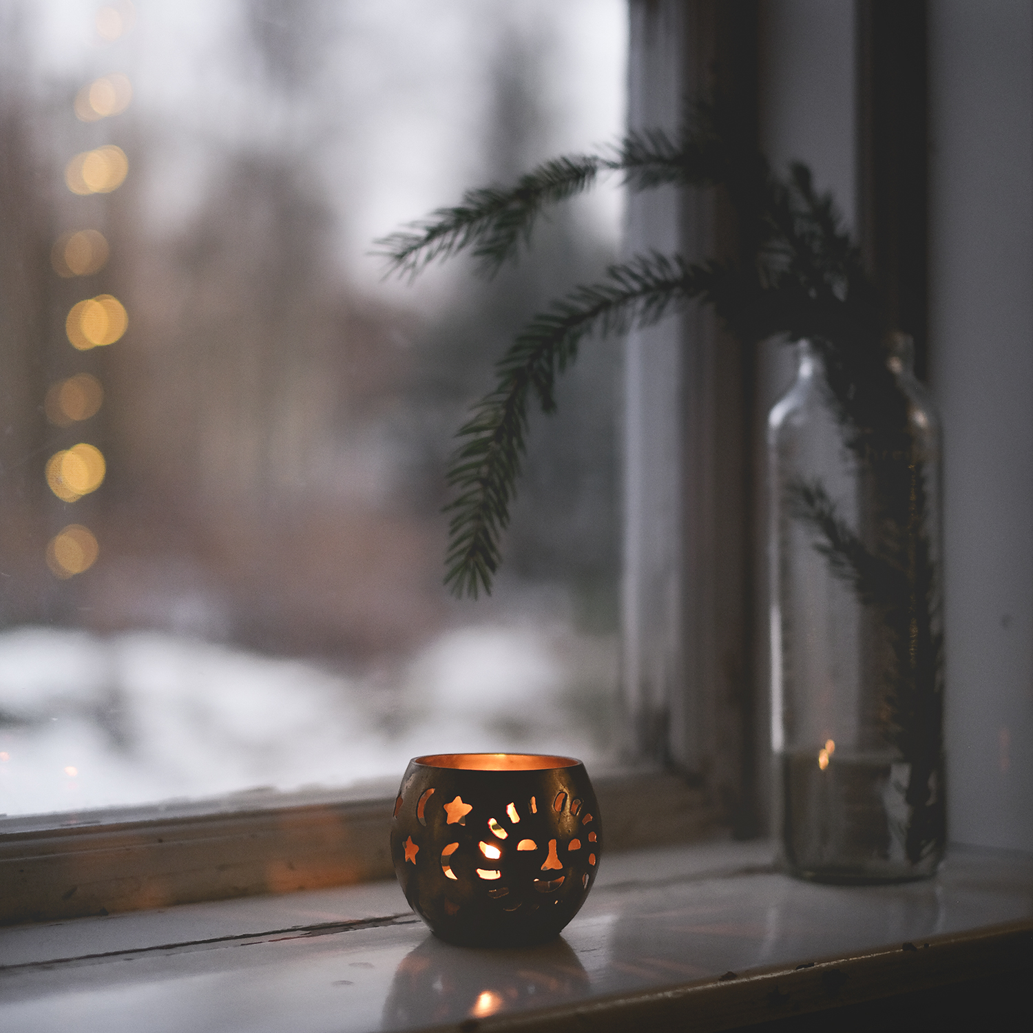 Scandi Christmas holidays, window with candle and snow outside. www.Fenne.be